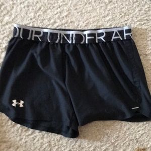 Under Armour black running shorts.